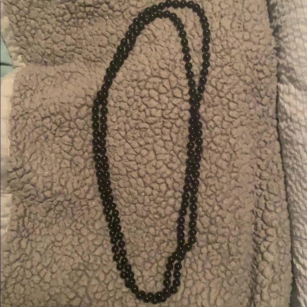 Very long black bead necklace bought from boutique